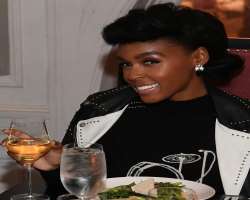 Janelle Monae consuming alcohol